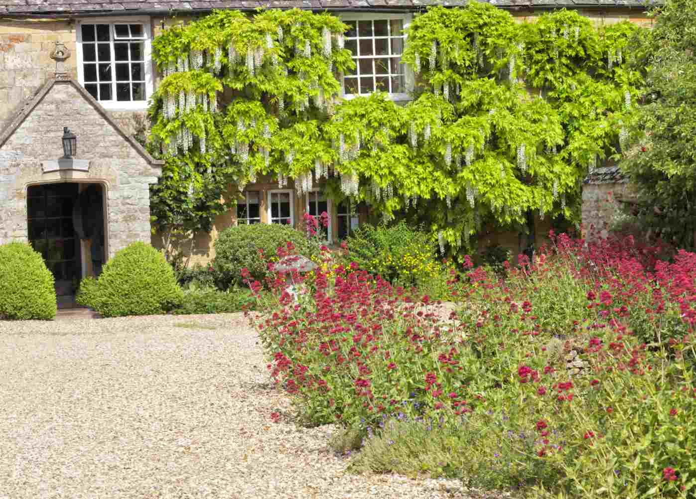 gravel driveway in front of a house