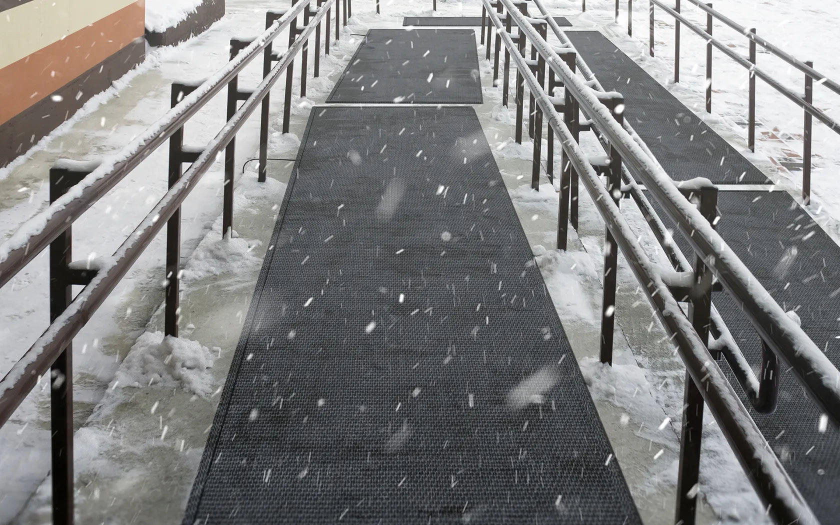 HeatTrak Pro snow melting walkway mats on a commercial property